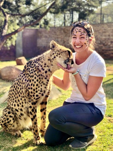 student with cheetah