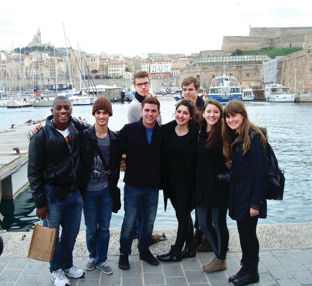 Students smiling on the docks