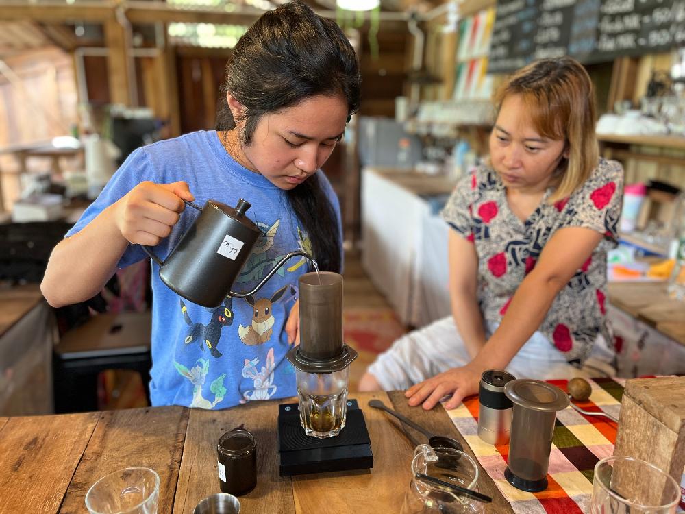 Student pouring coffee
